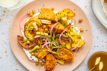 Roasted squash salad with crispy chick peas and pickled onion