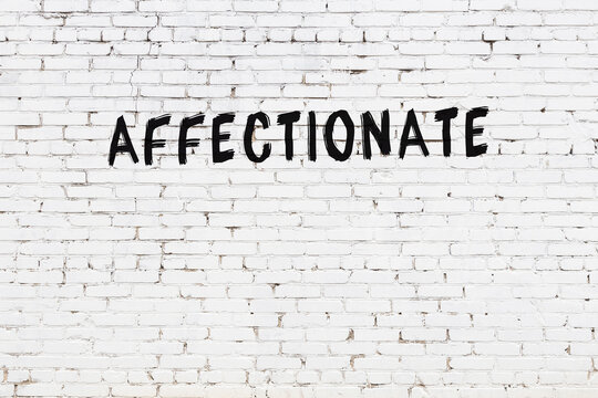 Inscription affectionate painted on white brick wall