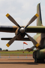 Military Transport Aircraft Propeller Engine And Airport Wind Sock