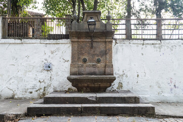An old abandoned water fountain. Drinking water fountain. Vassouras, Rio de Janeiro.