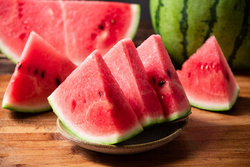 fresh sliced watermelon fruit on wooden  background - Powered by Adobe