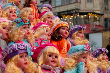 Beautiful cute girl baby dolls for sale at retail shop at Christmas market, New Market area, Kolkata, West Bengal, India.