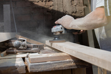 man working in his workshop with wood