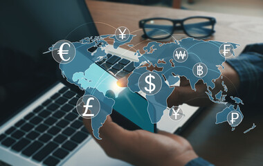 Men use mobile phones and laptop computers with foreign currency.  in the concept of money transfer.  Currency exchange.  Global business.  Financial technology.  Online interbank payments.