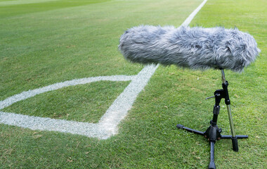 The long gun microphone on the soccer field, microphone for live events, Recording devices is...