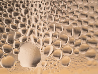 Water drops background texture. Backdrop glass covered with drops of water. bubbles in water