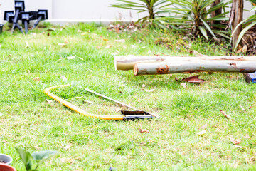 A carpenter is cutting and constructing a large tree crutches.