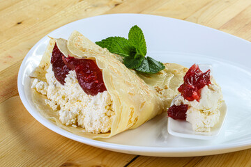 Pancake with cottage cheese and jam