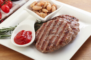 Grilled beef burger cutlet with sauce