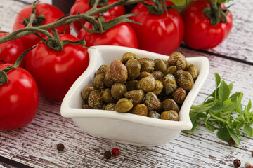 Marinated green capers in the bowl
