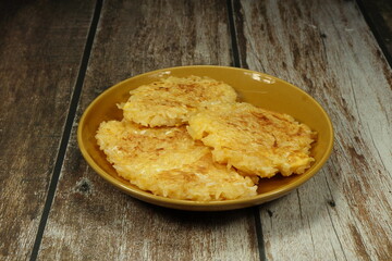 Pile of deep fried sticky rice and chicken egg serving on the plate. Famous traditional rice menu in Thailand.
