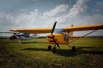 Fototapeta na wymiar Children launch model airplanes at an air show on a summer day