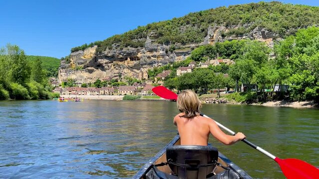 paddler in canoe on a river
