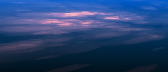 Fototapeta premium Panoramic view of a pink and blue sky at sunset. Clouds with sky panorama background.