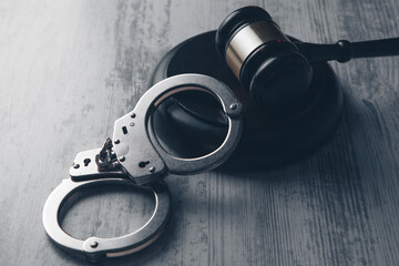 Legal law concept image - gavel and handcuffs