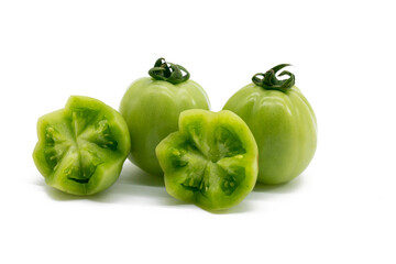 Fresh green unripe tomatoes isolated on white background