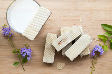 milks with wafer dessert snack of lifestyle arrangement flat lay style on background wooden
