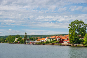 Fototapeta na wymiar View of houses on the shore of Lake Vättern in the town of Hjo in Sweden