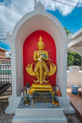 The gold giant statue at Wat Ming Muang, Nan province, Thailand