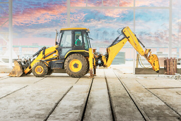 Professional demolition of reinforced concrete structures with an industrial hydraulic hammer with...