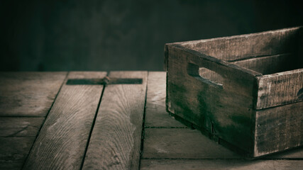 Shabby wooden box placed on table in kitchen