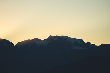 Sunset behind the Mount Tödi in the swiss alps.