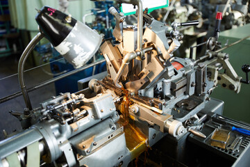 Automatic powerful lathe machine using water-based cutting fluid for production of clock movements...