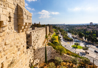 Walls and flanks of Tower Of David citadel with Old City walls over Hativat Yerushalayim street in Jerusalem in Israel