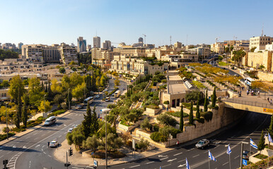 Walls of Tower Of David citadel and Old City over Jaffa Gate and Hativat Yerushalayim street with...