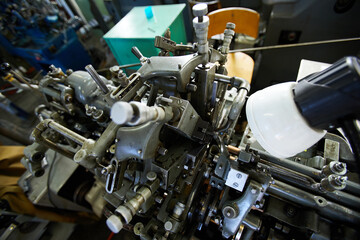 Close-up of industrial machine of clock factory used for making small watch movements
