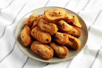 Homemade Chocolate Chips Madeleines on a Plate, side view.