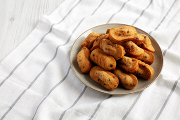 Homemade Chocolate Chips Madeleines on a Plate, low angle view. Copy space.