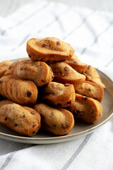 Homemade Chocolate Chips Madeleines on a Plate, side view. Close-up.