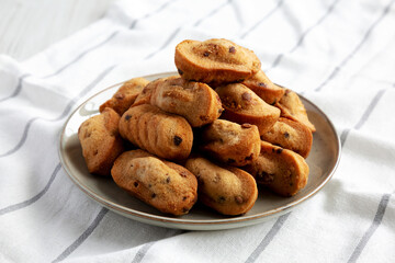 Homemade Chocolate Chips Madeleines on a Plate, side view.