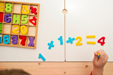 3D wooden numbers. Implement for learning to count with help of digits and "pop it" toy. Addition and subtraction exercises. Mathematical equation for preschool children.