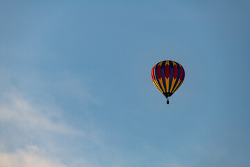 Hot air balloons floating in the air over the City of Burlington, WI