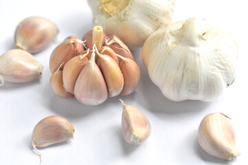 garlic bulbs and garlic cloves on white background. close-up. Organic garlic top view. Concept of spices for healthy cooking.
