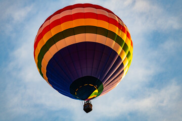 Hot air balloons floating in the air over the City of Burlington, WI