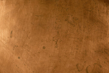 Grunge copper background. Left natural lighting. Copy space.