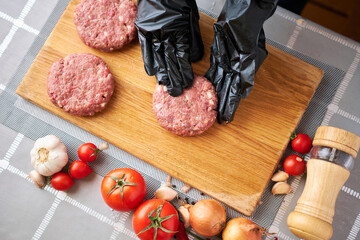 Making Billets for burgers from fresh minced meat on domestic kitchen