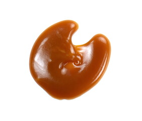 Sweet caramel sauce isolated on white background close up. Golden Butterscotch toffee caramel liquid. Melted caramel sauce drop.