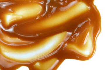 Sweet caramel sauce drop background close up. Golden Butterscotch toffee caramel liquid. 