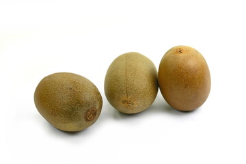 Whole golden kiwifruit kiwi (Actinidia chinensis) on white background