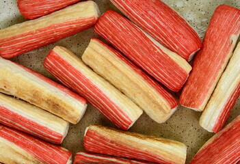 Fried Crab sticks in frying pan. 