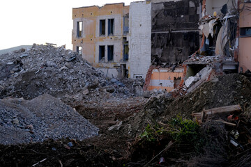 ruined house with empty windows, broken brick, cracks on the wall of a dilapidated building, the concept of ruin of people, business collapse due to Social problems, poverty, Low income, Urban decay