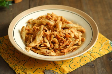 a plate of fried crispy fish on the table 