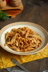 a plate of fried crispy fish on the table 