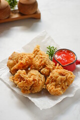 a plate of fried chicken in white background