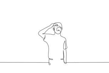 man stands looking into the distance hand over eyes - one line drawing. concept of forecasting, perspective review, anticipation, observation of the situation