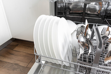 Full load dishwashing machine. Clean dishes and cutlery